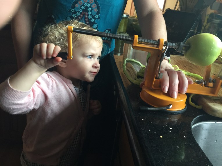 This year Sofia is big enough to turn the peeler's handle!